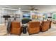 Cozy living room with leather armchairs, a flat-screen TV, and stylish decor at 150 Trinity Farm Dr, Canton, GA 30115