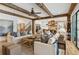 Open concept living room flows into the kitchen, complemented by hardwood floors and stylish furnishings at 150 Trinity Farm Dr, Canton, GA 30115