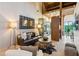Open concept living room features vaulted ceilings, hardwood floors, and stylish modern furnishings at 150 Trinity Farm Dr, Canton, GA 30115