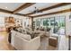 Spacious living room with an open layout, seamlessly connecting to the outdoors and the modern kitchen at 150 Trinity Farm Dr, Canton, GA 30115