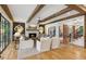Elegant living room with exposed ceiling beams and a cozy fireplace at 150 Trinity Farm Dr, Canton, GA 30115