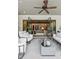 Stylish covered patio with ceiling fan, comfortable seating, and view to interior at 150 Trinity Farm Dr, Canton, GA 30115