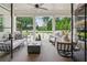 Stylish outdoor living space with comfortable seating, pool view, and lush landscaping at 150 Trinity Farm Dr, Canton, GA 30115