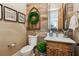 Charming powder room with wood accent wall, marble countertop, and rustic decor at 150 Trinity Farm Dr, Canton, GA 30115