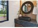 Stylish powder room with a vessel sink, granite countertop, ornate mirror, and a window offering views of the outdoors at 150 Trinity Farm Dr, Canton, GA 30115