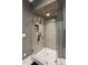 Glass enclosed shower with gray tiling and a built-in shelf at 150 Trinity Farm Dr, Canton, GA 30115