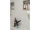Bright, all-white shower featuring mosaic tile floor, and a built-in shelf for toiletries at 150 Trinity Farm Dr, Canton, GA 30115