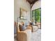 Comfortable sitting area with cozy armchairs and backyard views, providing a relaxing space to enjoy the natural surroundings at 150 Trinity Farm Dr, Canton, GA 30115