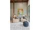 Cozy sitting area with two armchairs, a side table, and a statement art piece creating a relaxing atmosphere with backyard views at 150 Trinity Farm Dr, Canton, GA 30115
