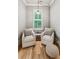 Cozy sitting area with two armchairs, a pendant light, and bright natural light at 150 Trinity Farm Dr, Canton, GA 30115