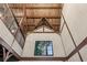 View of interior wall with wood beam construction, modern window, and natural light at 150 Trinity Farm Dr, Canton, GA 30115