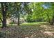 Expansive backyard features lush greenery, mature trees, and ample space for outdoor activities at 1829 Goddard Se St, Atlanta, GA 30315