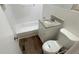 Well-lit bathroom with a tub, updated vanity, and modern fixtures at 1829 Goddard Se St, Atlanta, GA 30315
