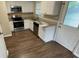 Modern kitchen with stainless steel appliances, granite countertops, and ample cabinet space at 1829 Goddard Se St, Atlanta, GA 30315