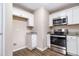 Kitchen with stainless steel appliances, granite countertops, and white cabinetry at 1829 Goddard Se St, Atlanta, GA 30315
