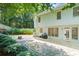 Enjoy a stone patio and a fenced-in backyard perfect for entertaining or relaxing by the fire pit at 1241 Newbridge Trce, Brookhaven, GA 30319