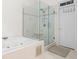 Bright bathroom features a glass shower and tub at 1241 Newbridge Trce, Brookhaven, GA 30319