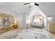 Bright bedroom with ceiling fan, light walls and large rug at 1241 Newbridge Trce, Brookhaven, GA 30319