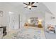Bright bedroom with ceiling fan, light walls and large rug at 1241 Newbridge Trce, Brookhaven, GA 30319