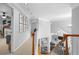 Upstairs hallway features neutral paint and carpet, views into the Bedroom and living room at 1241 Newbridge Trce, Brookhaven, GA 30319