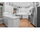 Modern kitchen with white cabinets, stainless steel appliances, and quartz countertops at 1241 Newbridge Trce, Brookhaven, GA 30319