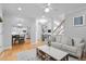 Open-concept living room, with hardwood floors, large windows, and modern decor at 1241 Newbridge Trce, Brookhaven, GA 30319