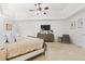 Stylish main bedroom with plush carpet, tray ceiling and ceiling fan at 1241 Newbridge Trce, Brookhaven, GA 30319