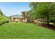 Expansive backyard with lush green lawn and mature trees, great for outdoor activities at 1869 Hebron Hills Dr, Tucker, GA 30084