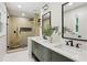 Modern bathroom featuring a double sink vanity, walk-in shower, and sleek fixtures at 1869 Hebron Hills Dr, Tucker, GA 30084