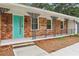 Charming front porch with ornate iron railings and a bright blue front door at 1869 Hebron Hills Dr, Tucker, GA 30084