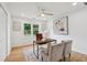 Inviting home office with hardwood floors, neutral paint, ceiling fan, and natural light from the window at 1869 Hebron Hills Dr, Tucker, GA 30084