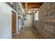 Unfinished basement with a water heater and concrete floor at 2247 Cherokee Valley Dr, Lithonia, GA 30058