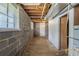 Unfinished basement with block walls, exposed ductwork, and concrete floor at 2247 Cherokee Valley Dr, Lithonia, GA 30058