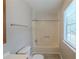 Bright bathroom featuring a shower-tub combo and tile flooring at 2247 Cherokee Valley Dr, Lithonia, GA 30058