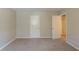 Bedroom with neutral walls and carpeting at 2247 Cherokee Valley Dr, Lithonia, GA 30058
