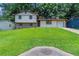 Charming split-level home with well-manicured lawn, stone accents, and attached garage in a desirable neighborhood at 2247 Cherokee Valley Dr, Lithonia, GA 30058