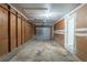 Garage featuring concrete flooring and a garage door at 2247 Cherokee Valley Dr, Lithonia, GA 30058
