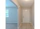 Welcoming hallway with tile flooring, neutral paint, and an open doorway leading to the living spaces at 2247 Cherokee Valley Dr, Lithonia, GA 30058