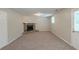 Living room features a stone fireplace, neutral walls and carpeting and a door at 2247 Cherokee Valley Dr, Lithonia, GA 30058