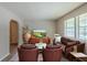Cozy living room featuring plush leather seating, stylish decor, and ample natural light from large windows at 2247 Cherokee Valley Dr, Lithonia, GA 30058