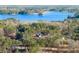 Stunning lakefront home nestled among lush trees with breathtaking water views, offering a serene and private retreat at 3735 Tamiami Trl, Cumming, GA 30041