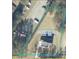 Aerial view of property shows the home and the surrounding parcel at 3735 Tamiami Trl, Cumming, GA 30041