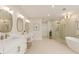 Luxurious bathroom features double sinks, a soaking tub, and a glass-enclosed shower at 3735 Tamiami Trl, Cumming, GA 30041