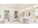 Spacious bathroom featuring dual vanities, makeup area, and separate water closet at 3735 Tamiami Trl, Cumming, GA 30041