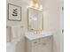 Contemporary bathroom features white quartz countertop, gold fixtures, and vanity with cabinet storage at 3735 Tamiami Trl, Cumming, GA 30041
