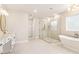 Elegant bathroom featuring a soaking tub, separate shower, and stylish fixtures at 3735 Tamiami Trl, Cumming, GA 30041