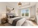 Beautiful bedroom with a large window, tray ceiling, neutral decor and stylish furnishings at 3735 Tamiami Trl, Cumming, GA 30041