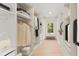 Spacious walk-in closet with custom shelving and ample storage for clothes and accessories at 3735 Tamiami Trl, Cumming, GA 30041