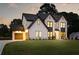 Beautiful exterior of a newly constructed home with a 2-car garage and manicured lawn at 3735 Tamiami Trl, Cumming, GA 30041