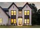 An eye-level front exterior view of a newly constructed home with an inviting front entrance at 3735 Tamiami Trl, Cumming, GA 30041